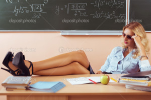 Beautiful young sexy teacher resting between the classes